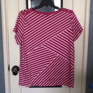 Pink and white striped shirt with fashionable buttons at the shoulders.